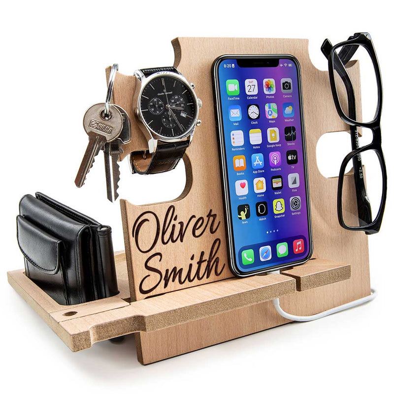 Natural finish wood personalized nightstand organizer holding phone, wallet, and engraved name, unique retirement gift for men