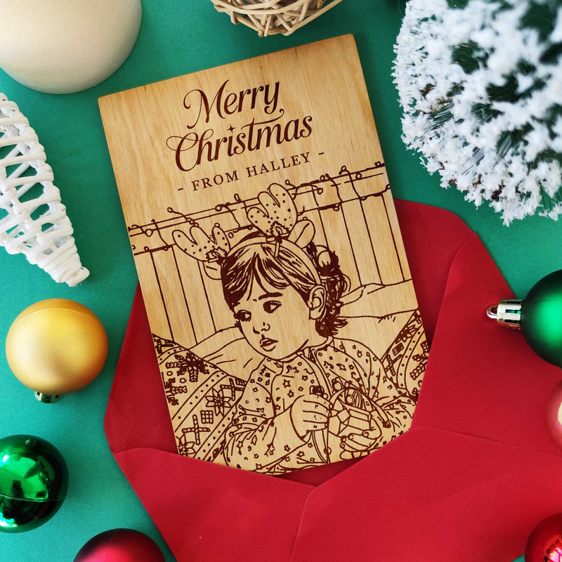 Laser engraved wooden Christmas card with child portrait — personalized baby gift.