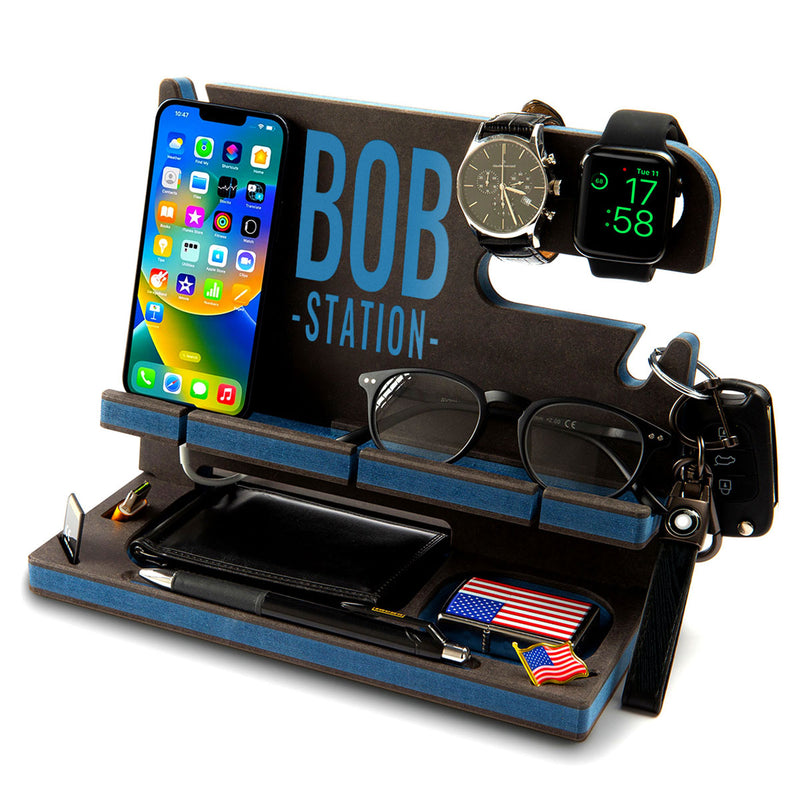 Black engineered wood desk organizer with blue edge profiles and a note in blue, thoughtful graduation gift for him