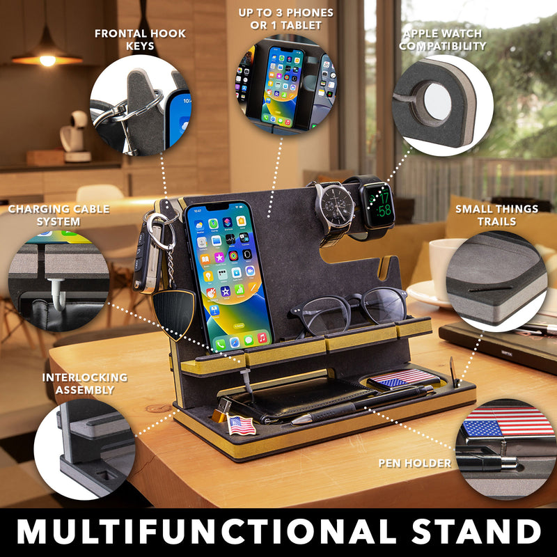 Black engineered wood phone stand with yellow accents on an office desk, featuring dedicated spaces for personal items, perfect gift for men
