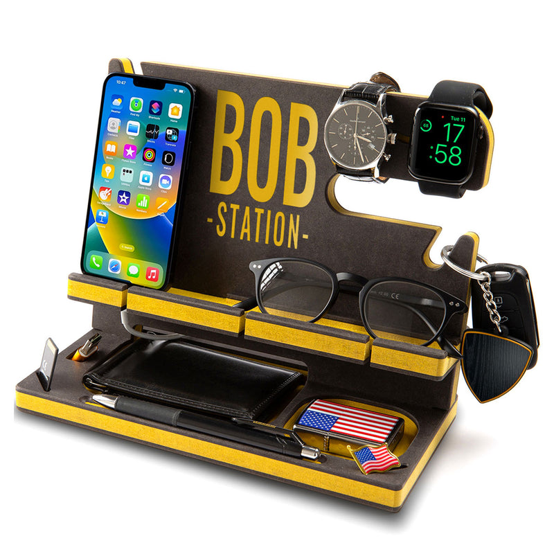 Black engineered wood phone stand with yellow detailing and a message in yellow, elegant anniversary gift for husband