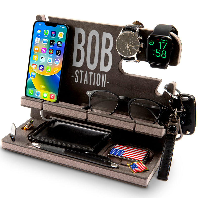 Black engineered wood phone stand with gray side details and a message in gray, stylish birthday gift for men